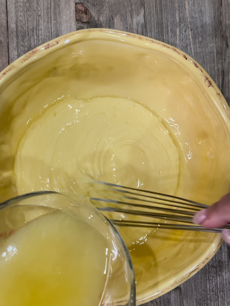 lemon juice being poured into bowl