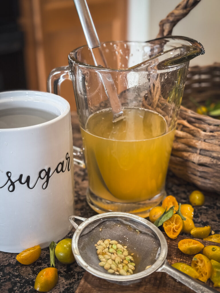 strainer with seeds and pitcher sugar container