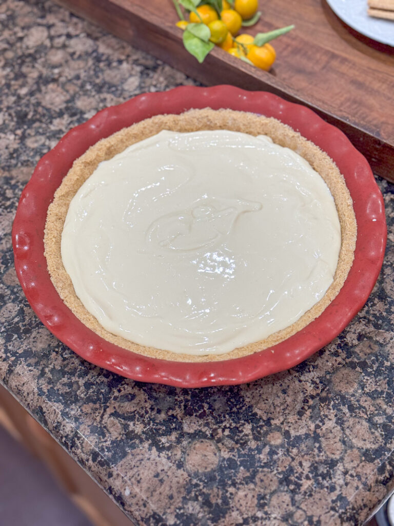 calamansi pie filling and graham cracker crust in pie plate