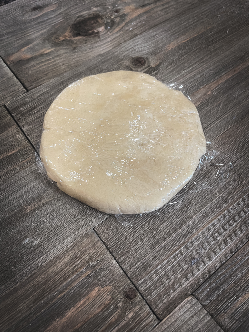 pie dough disc wrapped in plastic wrap