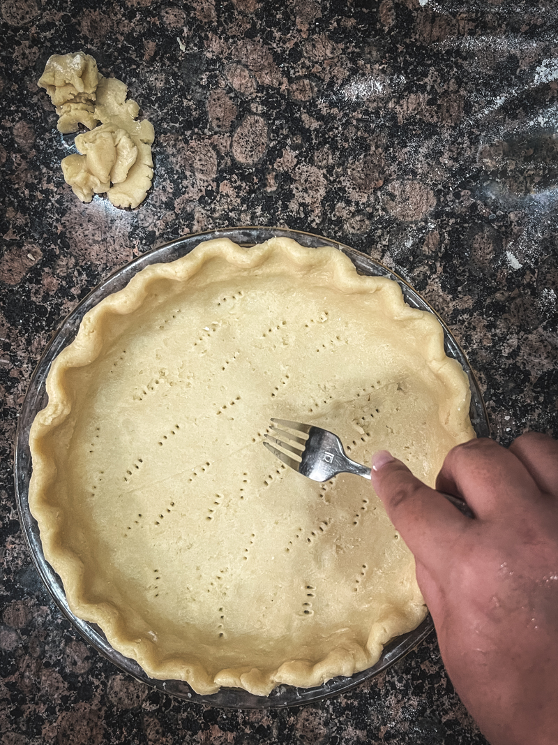 piercing pie crust with fork