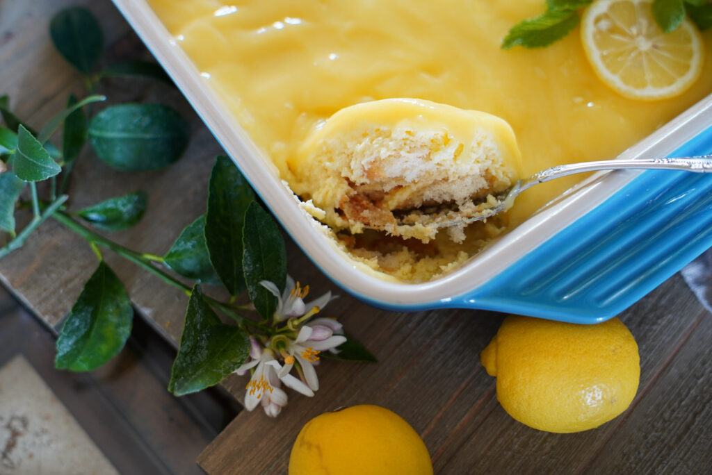 Lemon tiramisu being scooped up by spoon.