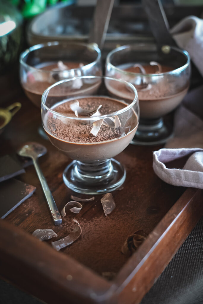 chocolate panna cotta in glass dessert bowl