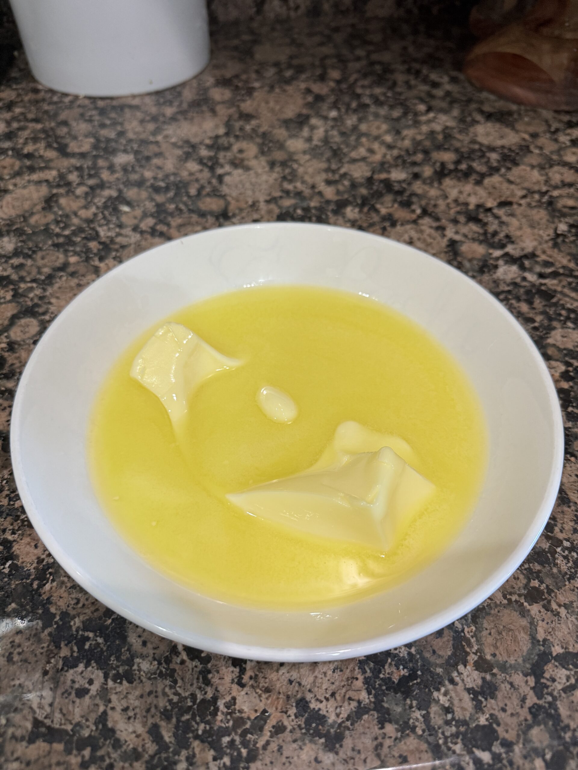 Melted butter in a shallow bowl