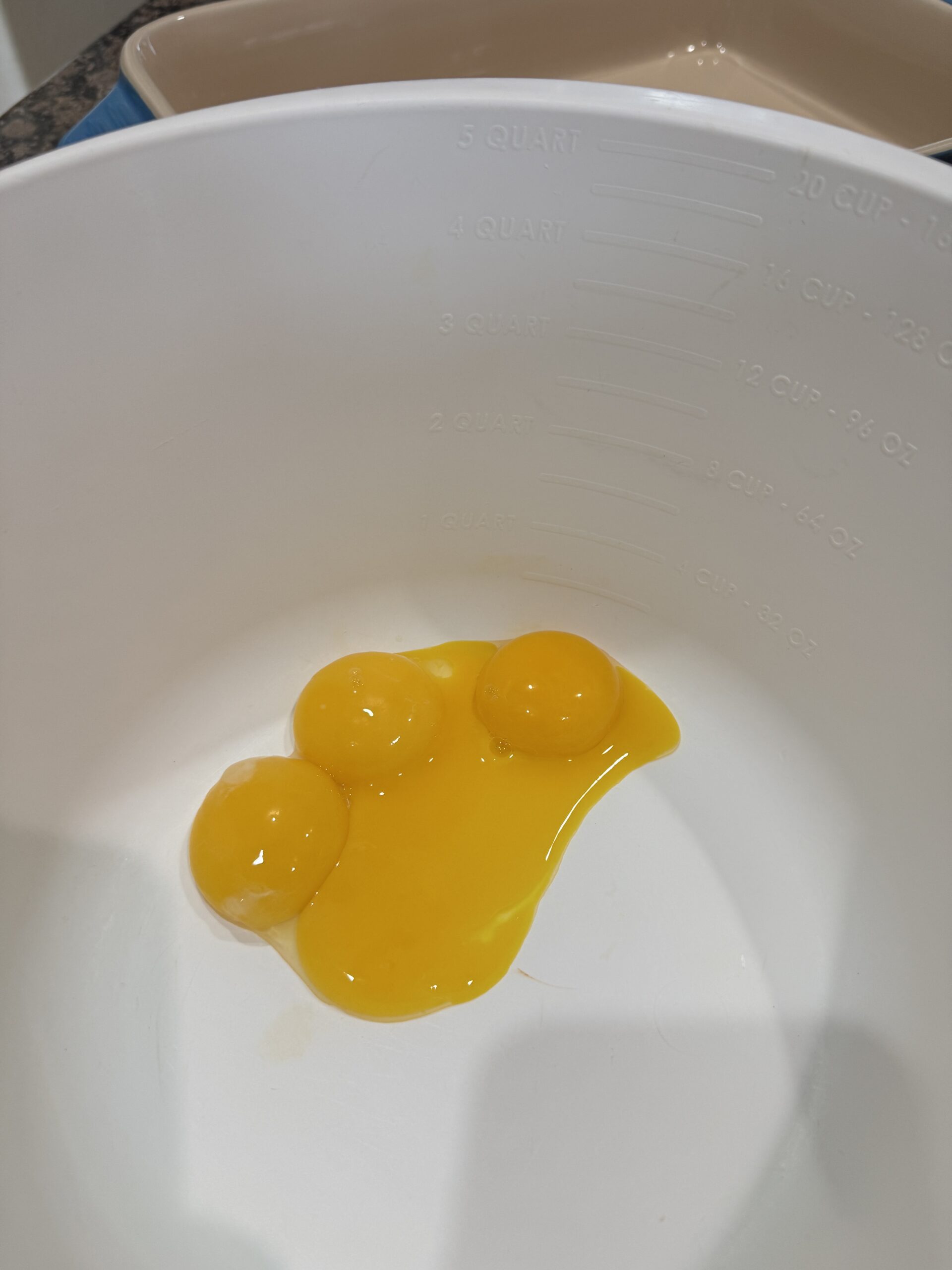 4 egg yolks in a bowl