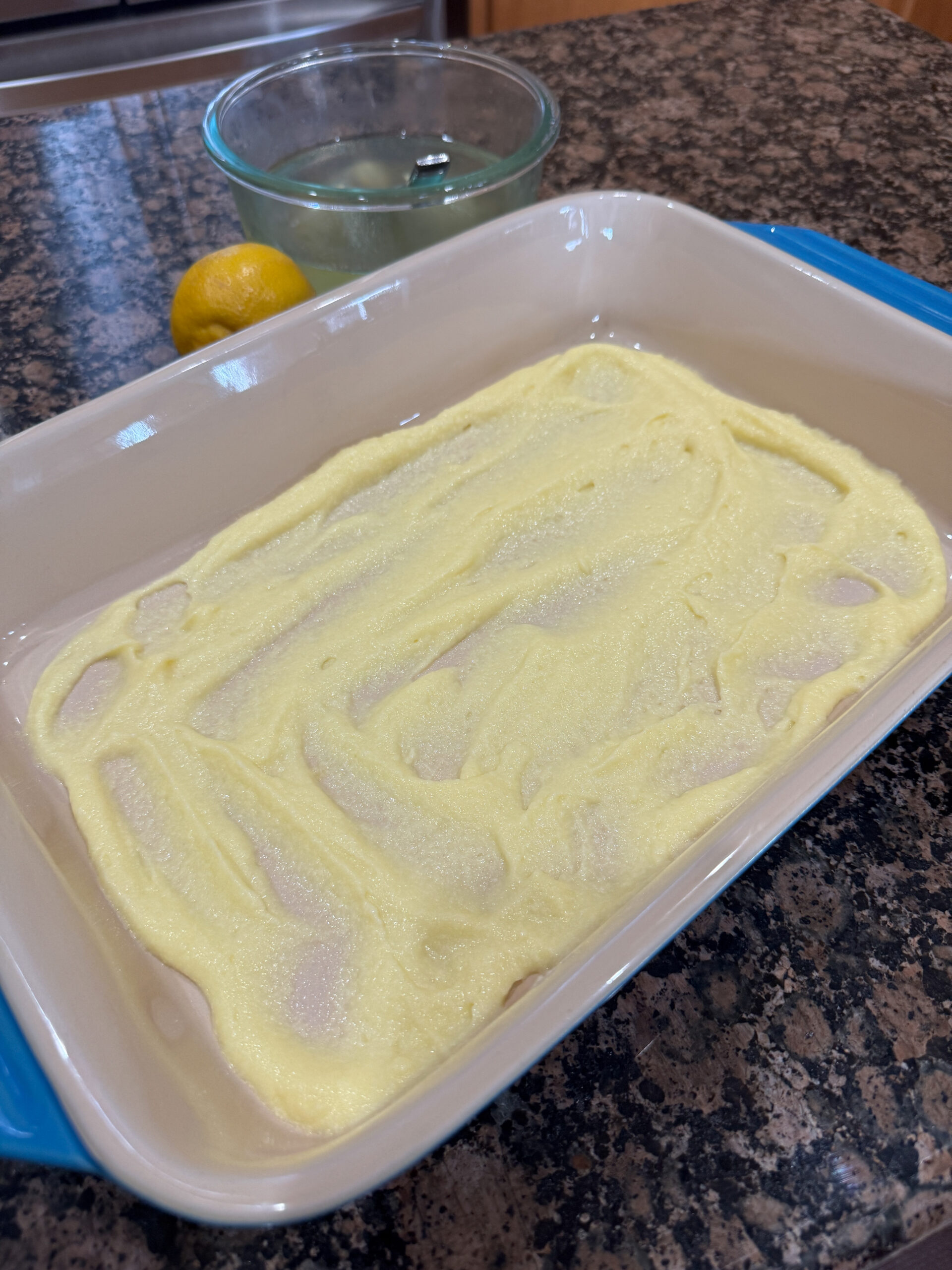 Mascarpone Cream spread on bottom of baking dish