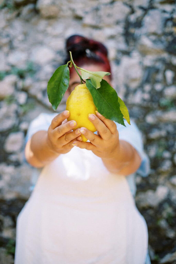 woman holding a lemon