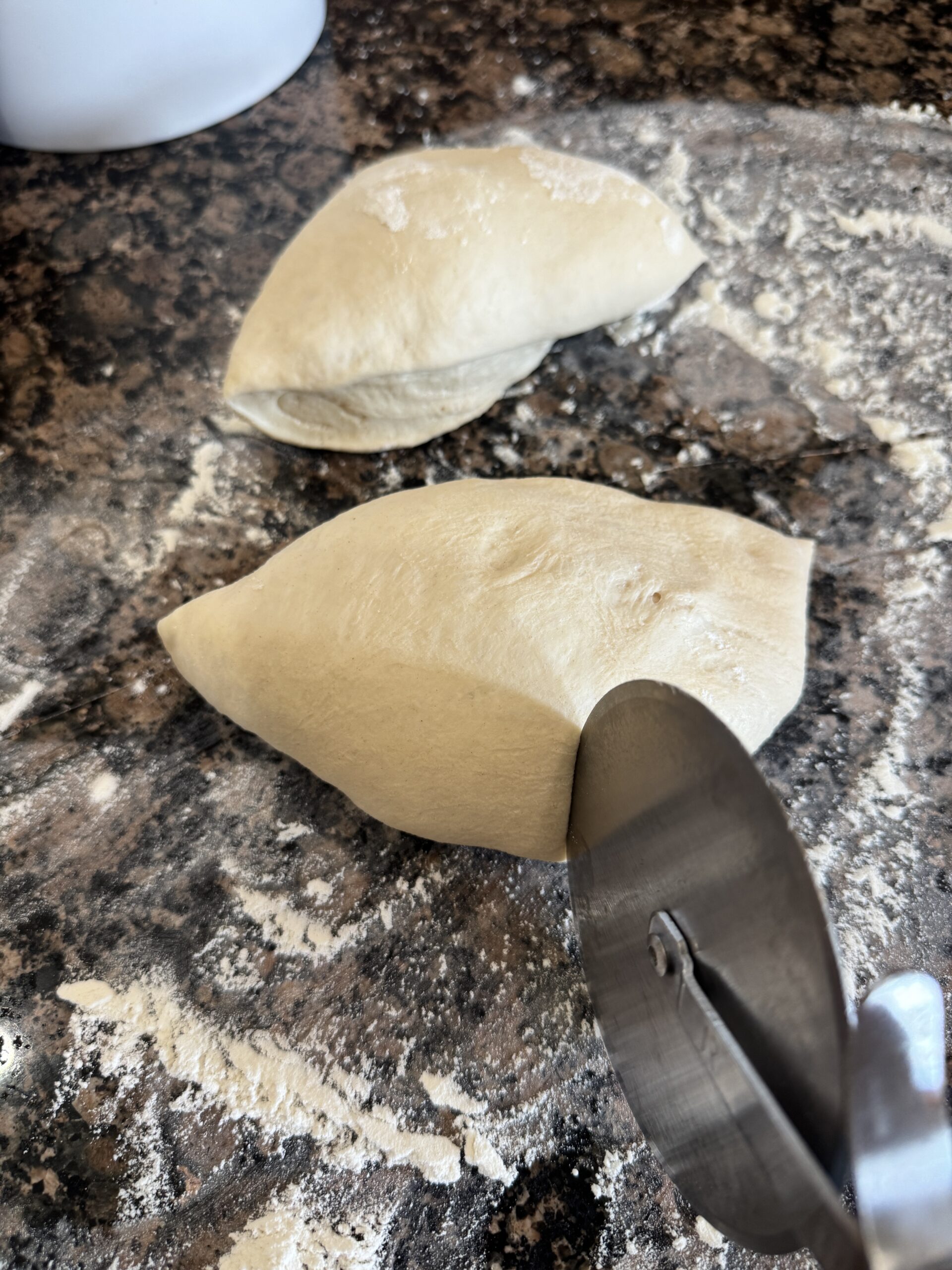 Dividing pizza dough into portions