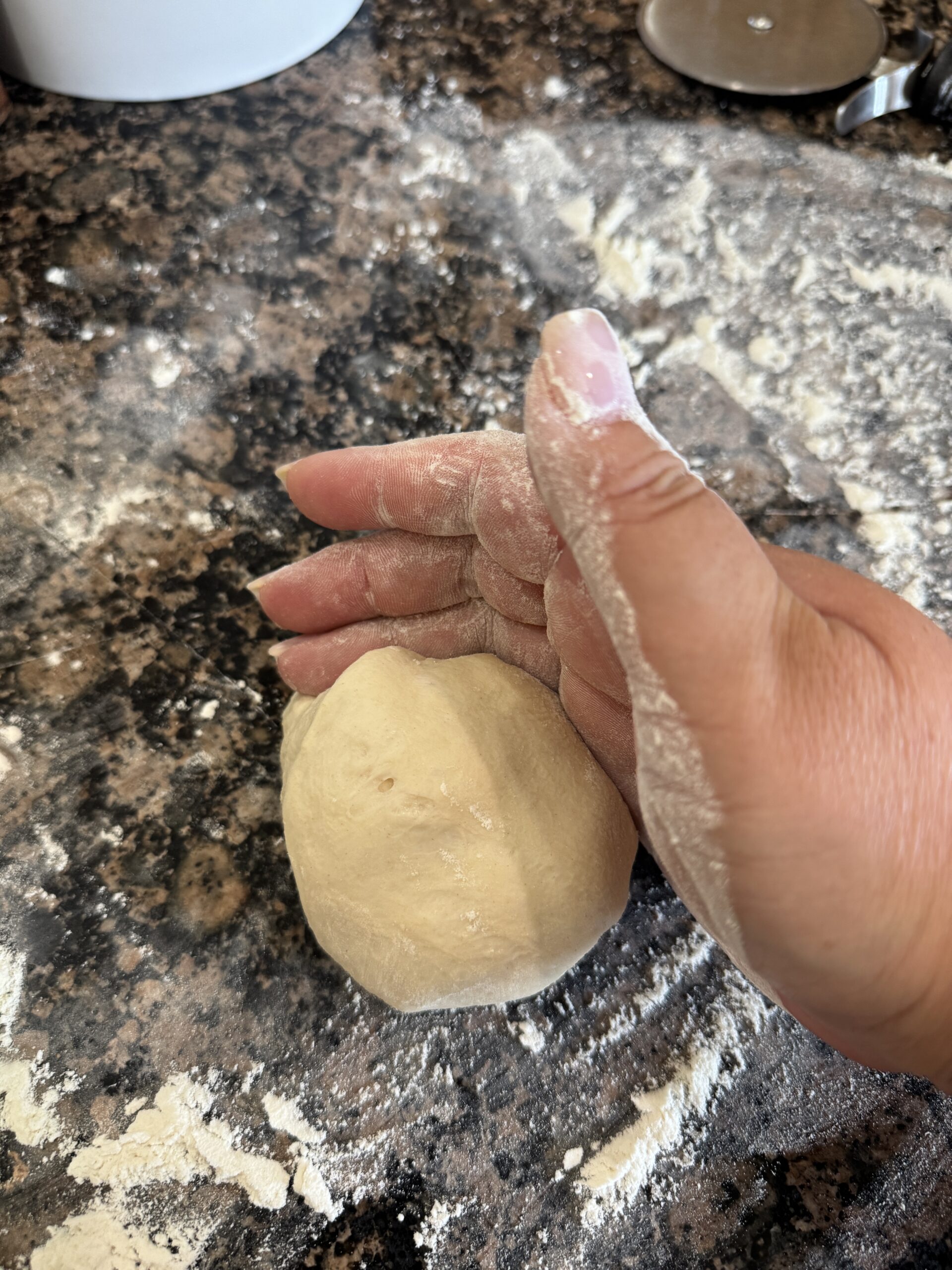 Forming pizza dough into balls