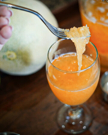 Ribbons of fresh cantaloupe in Filipino Cantaloupe Juice.