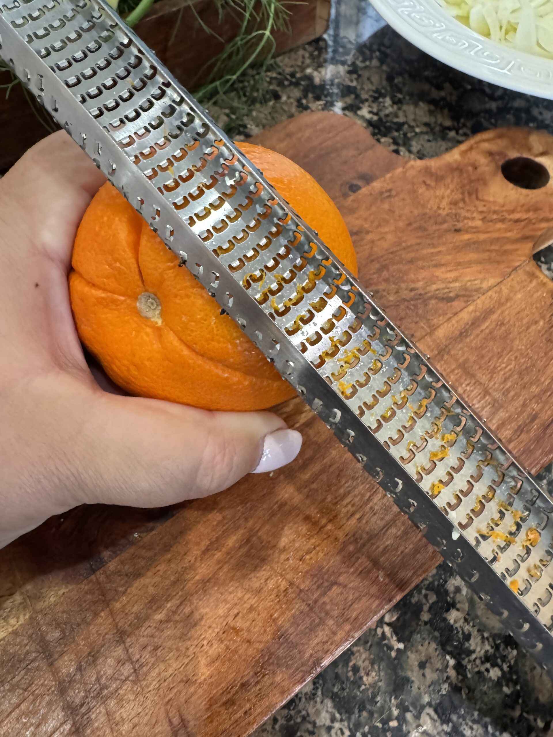 Zesting a fresh orange.