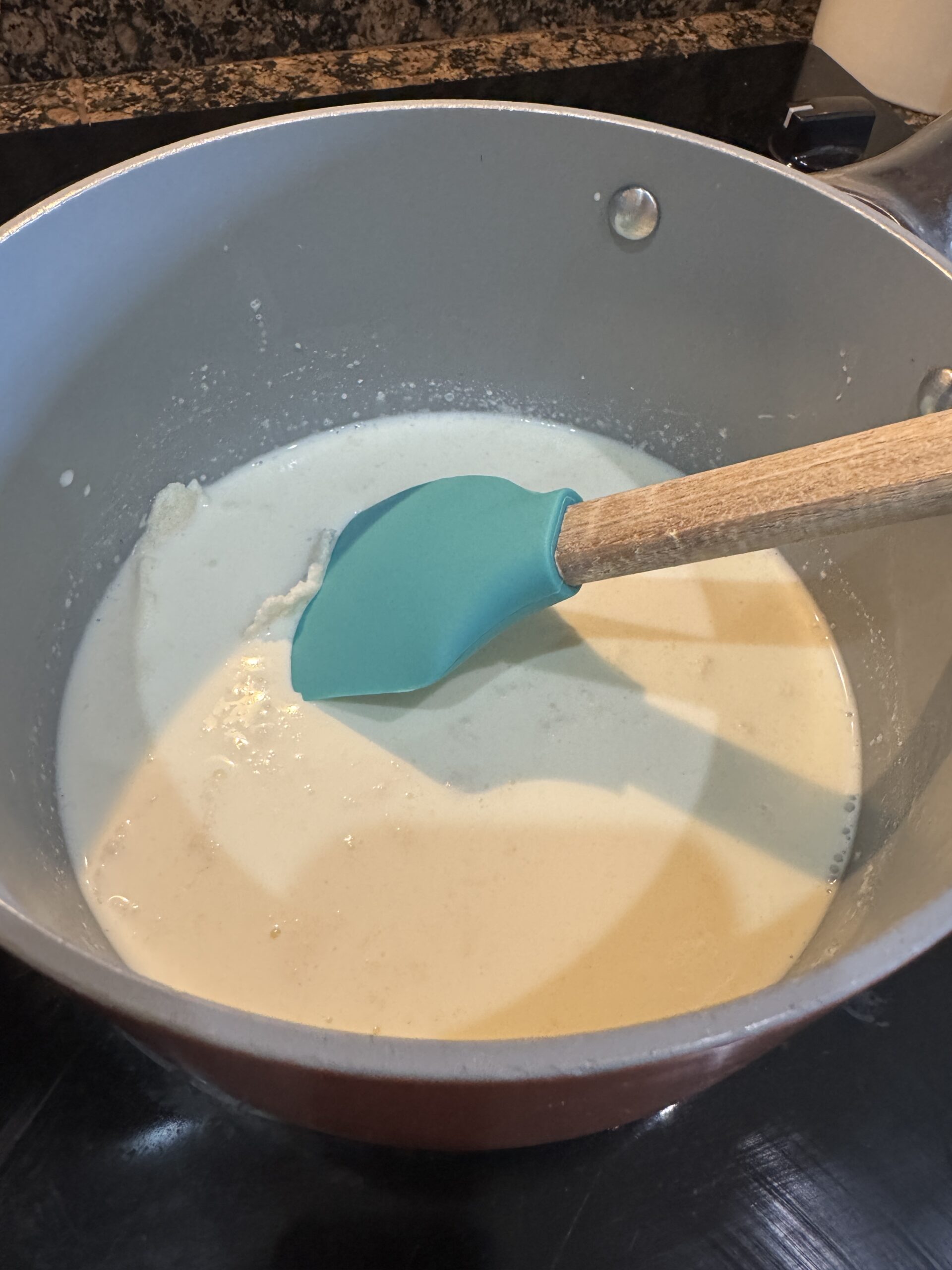 stirring bloomed gelatin into cream and milk