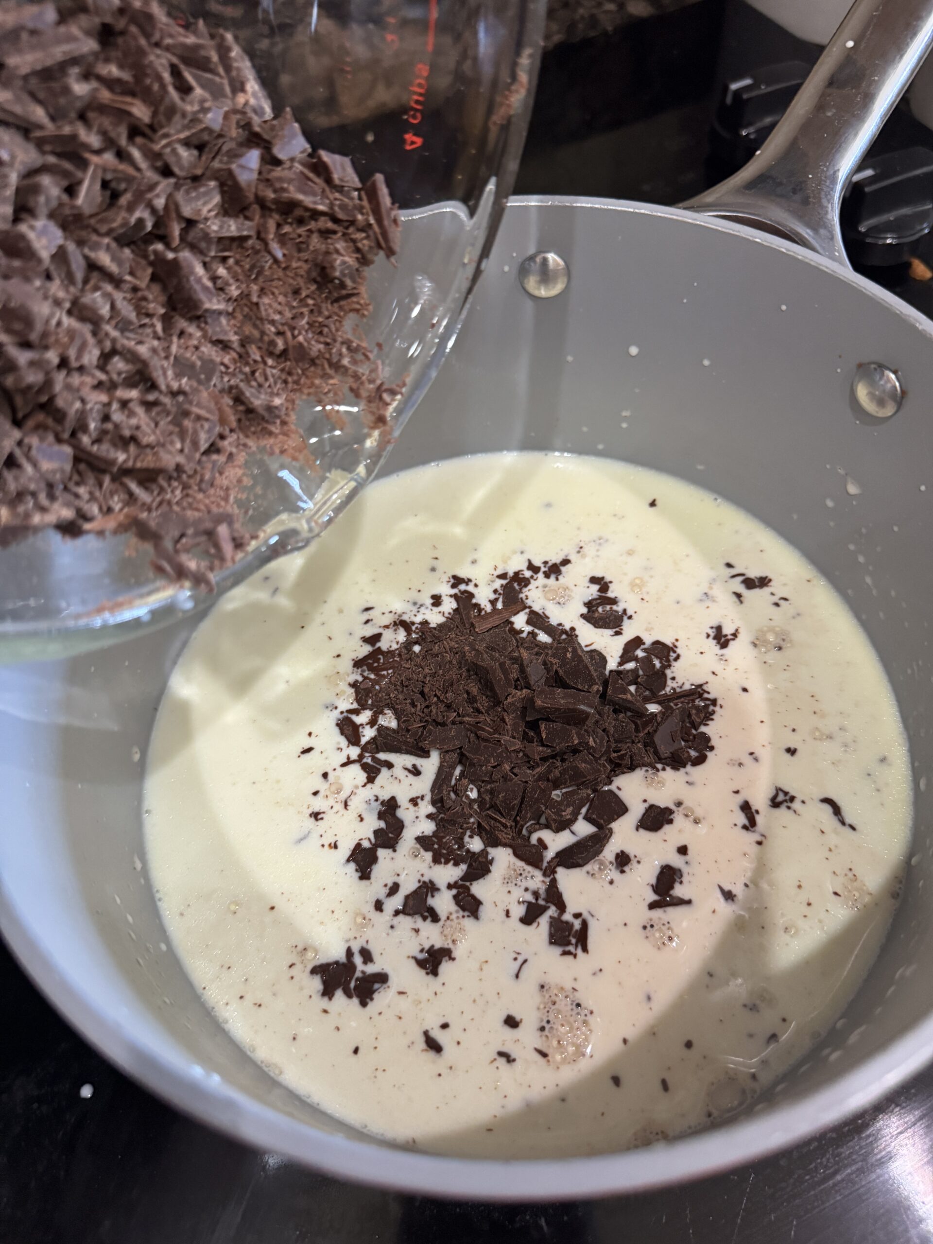 adding chocolate to cream and gelatin mixture